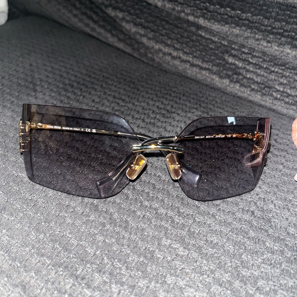 Miu Miu Light Grey rimless sunglasses